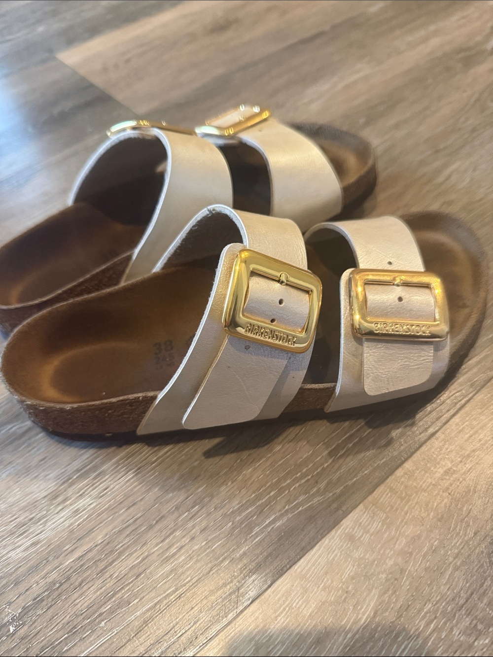 Birkenstock Women’s Off-White Two-Strap Sandals with Gold Buckles